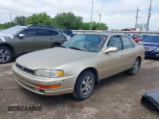 1996 Toyota Camry DX with VIN 4T1BG12K7TU781388, listed as a IAAI auction lot 42089118 with 196,988 mi miles. Bid and sale history available at carsss.com. Image 2.