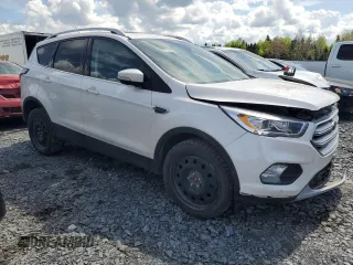 2018 Ford Escape Titanium z VIN 1FMCU9J94JUD09141, wystawiony jako Copart lot #56625805 z przebiegiem Nie podano mil oraz Szkoda całkowita • Salvage title. Historia ofert i sprzedaży dostępna na DreamBid. Obrazek 4.