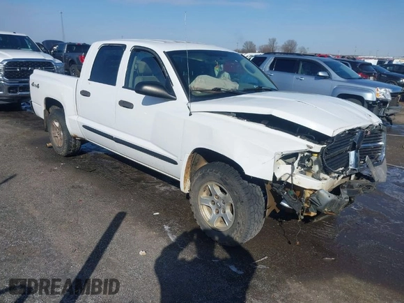 2005 Dodge Dakota SLT with VIN 1D7HW48N85S226460, listed as a IAAI auction lot 41568128 with 213,159 mi miles and . Bid and sale history available at carsss.com. Image 1.