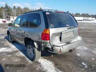 2002 GMC Envoy SLT with VIN 1GKDT13S822154592, listed as a IAAI auction lot 41389285 with 153,897 mi miles. Bid and sale history available at carsss.com. Image 6.