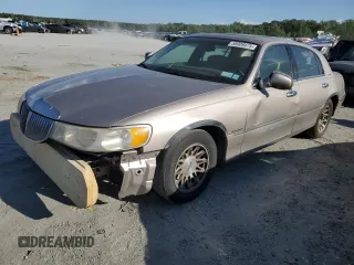 1999 Lincoln Town Car Signature z VIN 1LNHM82W7XY626305, wystawiony jako Copart lot #58009475 z przebiegiem Nie podano mil oraz Szkoda całkowita • Salvage title. Historia ofert i sprzedaży dostępna na DreamBid. Obrazek 1.