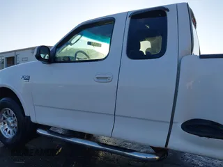 2003 Ford F-150 z VIN 2FTRX08W63CA22223, wystawiony jako IAAI lot #41382377 z przebiegiem 261 841 mil mil oraz . Historia ofert i sprzedaży dostępna na DreamBid. Obrazek 14.