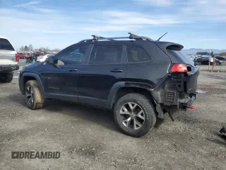 2014 Jeep Cherokee Trailhawk with VIN 1C4PJMBS9EW159993, listed as a Copart auction lot 46935105 with 128,140 mi miles and Salvage Title. Bid and sale history available at carsss.com. Image 2.