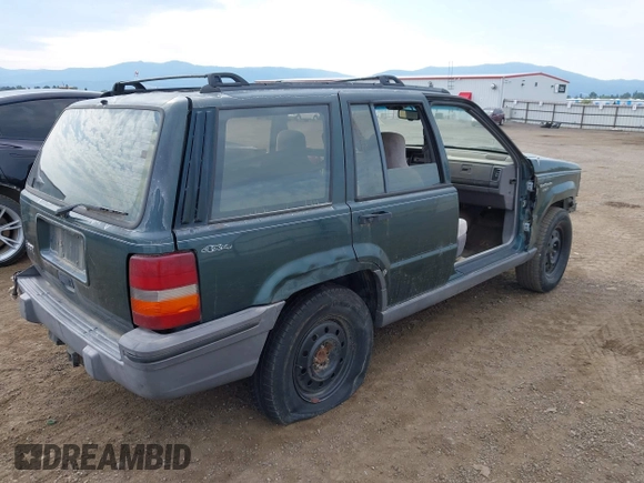 1994 Jeep Grand Cherokee Laredo with VIN 1J4GZ58S9RC215874, listed as a IAAI auction lot 42577378 with 230,824 mi miles and . Bid and sale history available at DreamBid. Image 4.