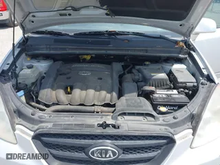 2007 Kia Rondo LX with VIN KNAFG525777087180, listed as a IAAI auction lot 42094657 with 125,256 mi miles. Bid and sale history available at carsss.com. Image 10.