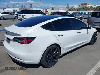 2019 Tesla Model 3 Mid Range with VIN 5YJ3E1EA5KF327181, listed as a IAAI auction lot 41860943 with 157,335 mi miles and . Bid and sale history available at DreamBid. Image 4.