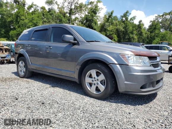 2013 Dodge Journey American Value with VIN 3C4PDCAB8DT566999, listed as a Copart auction lot 61361315 with 183,897 mi miles and Salvage title. Bid and sale history available at DreamBid. Image 4.