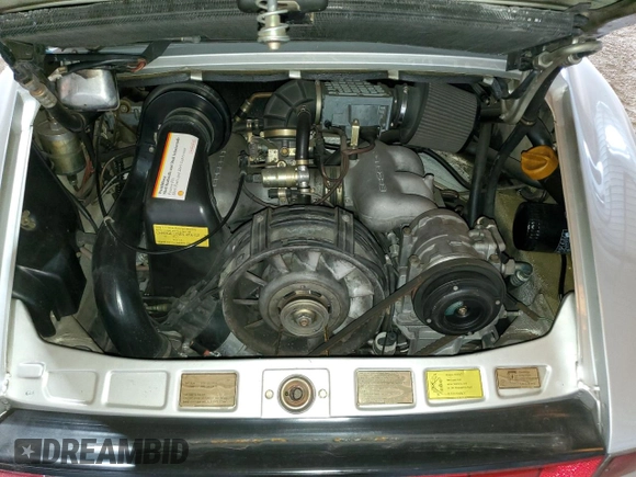 1988 Porsche 911 z VIN WP0EB0913JS161203, wystawiony jako Copart lot #71547754 z przebiegiem 109 128 mil mil oraz Szkoda całkowita • Salvage title. Historia ofert i sprzedaży dostępna na DreamBid. Obrazek 11.