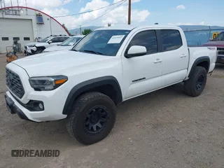 2022 Toyota Tacoma SR with VIN 3TMCZ5AN1NM478457, listed as a IAAI auction lot 42479107 with 59,547 mi miles and . Bid and sale history available at DreamBid. Image 19.