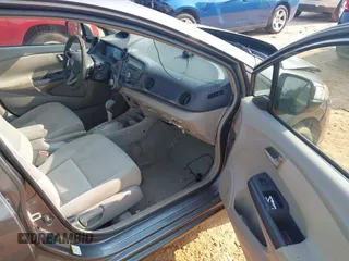 2010 Honda Insight EX with VIN JHMZE2H74AS027020, listed as a IAAI auction lot 42394875 with 248,003 mi miles and . Bid and sale history available at DreamBid. Image 5.