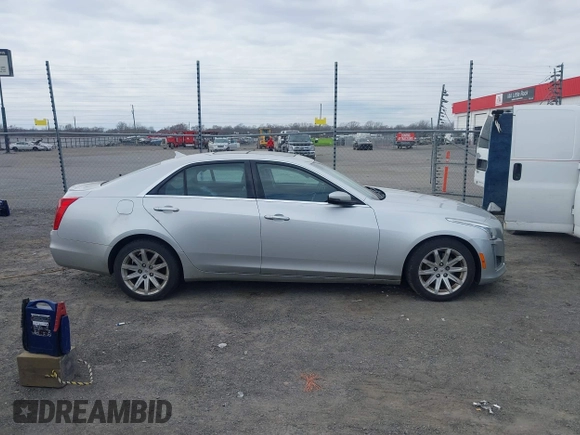 2014 Cadillac CTS Luxury AWD z VIN 1G6AX5SX2E0196881, wystawiony jako IAAI lot #41707633 z przebiegiem 169 168 mil mil oraz . Historia ofert i sprzedaży dostępna na DreamBid. Obrazek 13.