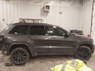 2018 Jeep Grand Cherokee Laredo E with VIN 1C4RJFAG6JC499261, listed as a IAAI auction lot 41033418 with 67,554 mi miles and . Bid and sale history available at DreamBid. Image 13.