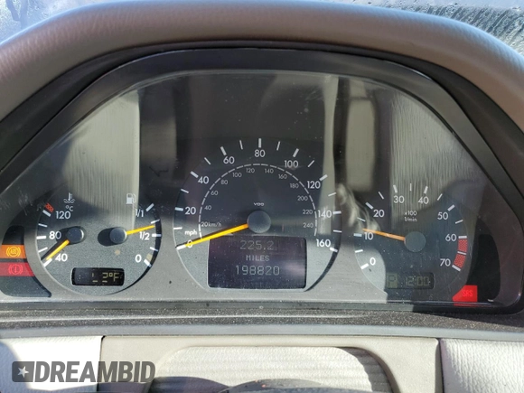 2002 Mercedes-Benz E-Class with VIN WDBJF65J32B494321, listed as a Copart auction lot 77557334 with 198,820 mi miles and Salvage Title. Bid and sale history available at carsss.com. Image 9.