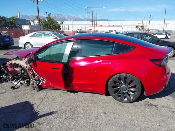 2021 Tesla Model 3 Performance with VIN 5YJ3E1EC7MF997237, listed as a IAAI auction lot 41387544 with 64,450 mi miles. Bid and sale history available at carsss.com. Image 14.