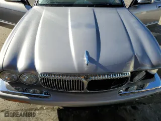2000 Jaguar XJ VDP with VIN SAJDA24C2YLF03686, listed as a Copart auction lot 77023654 with 215,569 mi miles and Salvage Title. Bid and sale history available at carsss.com. Image 11.