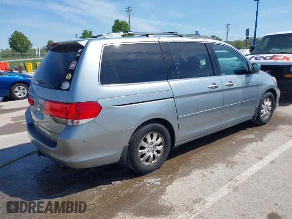2010 Honda Odyssey EX with VIN 5FNRL3H44AB059711, listed as a IAAI auction lot 42057760 with 225,486 mi miles and . Bid and sale history available at DreamBid. Image 4.