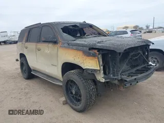 2015 GMC Yukon SLT with VIN 1GKS1BKC0FR114047, listed as a IAAI auction lot 41272792 with 1 mi miles. Bid and sale history available at carsss.com. Image 1.