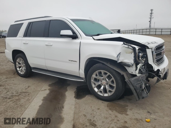 2015 GMC Yukon SLE with VIN 1GKS1AKC8FR733084, listed as a Copart auction lot 82960064 with 163,576 mi miles and Salvage Title. Bid and sale history available at carsss.com. Image 4.