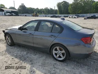 2014 BMW 3 Series 328i with VIN WBA3A5G50ENP33259, listed as a Copart auction lot 57330615 with 217,779 mi miles and Salvage title. Bid and sale history available at DreamBid. Image 2.