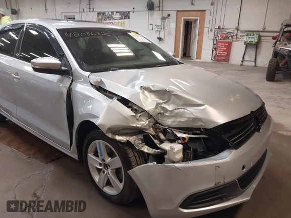 2014 Volkswagen Jetta TDI w/Premium with VIN 3VW3L7AJ6EM379401, listed as a IAAI auction lot 42086326 with 89,870 mi miles and . Bid and sale history available at DreamBid. Image 6.