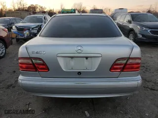2000 Mercedes-Benz E-Class with VIN WDBJF70J7YB049473, listed as a Copart auction lot 82396624 with 197,515 mi miles and Salvage Title. Bid and sale history available at carsss.com. Image 6.