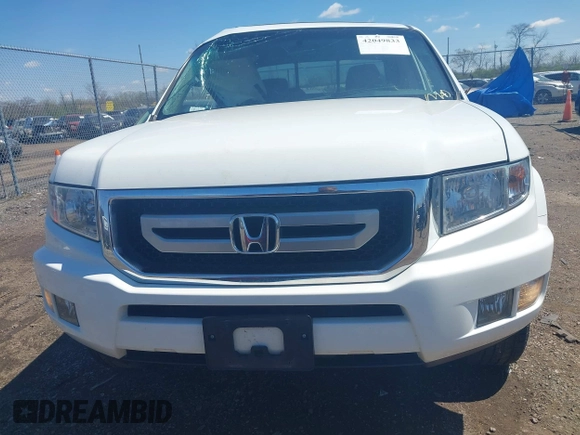 2009 Honda Ridgeline RTL with VIN 5FPYK16529B107871, listed as a IAAI auction lot 42049833 with 141,214 mi miles. Bid and sale history available at carsss.com. Image 13.