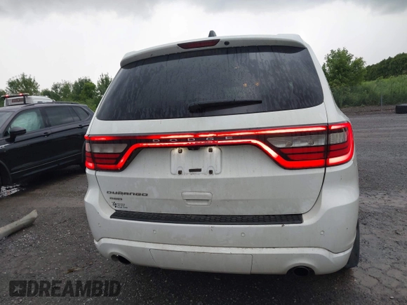 2014 Dodge Durango SXT with VIN 1C4RDJAG0EC561950, listed as a IAAI auction lot 42650331 with 106,959 mi miles and . Bid and sale history available at DreamBid. Image 17.