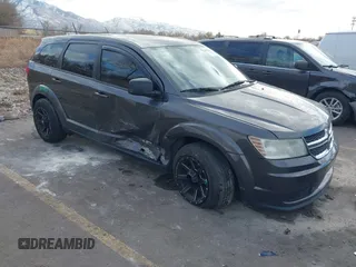 2014 Dodge Journey American Value Pkg with VIN 3C4PDCAB5ET235427, listed as a IAAI auction lot 41056216 with 164,740 mi miles. Bid and sale history available at carsss.com. Image 1.