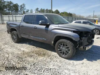 2023 Toyota Tundra Platinum with VIN 5TFNA5DBXPX073809, listed as a Copart auction lot 51221005 with 60,726 mi miles and Salvage title. Bid and sale history available at DreamBid. Image 4.