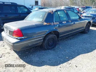 1998 Ford Crown Victoria Police with VIN 2FAFP71WXWX184526, listed as a IAAI auction lot 41563307 with 309,303 mi miles. Bid and sale history available at carsss.com. Image 4.