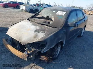 2003 Toyota Corolla CE with VIN 1NXBR32E43Z047677, listed as a IAAI auction lot 41427393 with 299,999 mi miles. Bid and sale history available at carsss.com. Image 2.