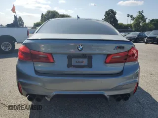 2018 BMW M5 z VIN WBSJF0C50JB282083, wystawiony jako Copart lot #55845673 z przebiegiem 39 691 mil mil oraz . Historia ofert i sprzedaży dostępna na DreamBid. Obrazek 6.