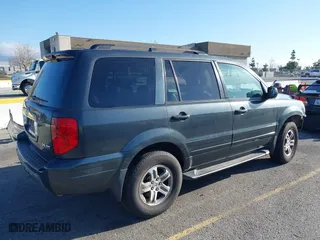 2003 Honda Pilot EX with VIN 2HKYF18633H599550, listed as a IAAI auction lot 41813549 with 242,103 mi miles. Bid and sale history available at carsss.com. Image 4.