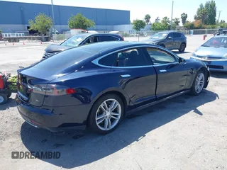 2014 Tesla Model S 60 with VIN 5YJSA1H12EFP46760, listed as a IAAI auction lot 42344596 with 106,252 mi miles and . Bid and sale history available at DreamBid. Image 4.