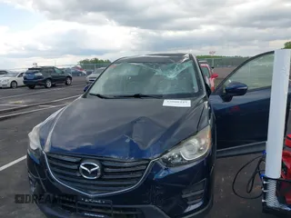 2016 Mazda CX-5 Sport with VIN JM3KE2BY3G0740488, listed as a IAAI auction lot 42000449 with 43,009 mi miles. Bid and sale history available at carsss.com. Image 6.