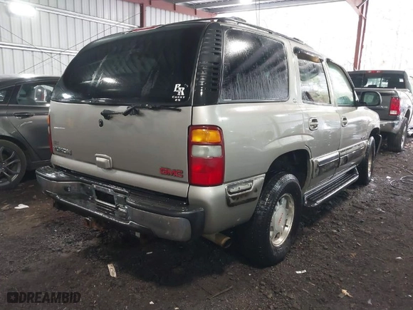 2001 GMC Yukon SLT with VIN 1GKEC13T91J202831, listed as a IAAI auction lot 41196576 with 252,478 mi miles. Bid and sale history available at carsss.com. Image 4.