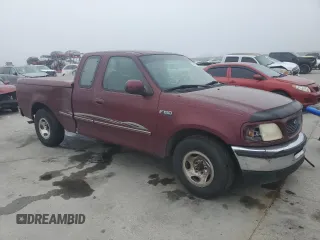 1997 Ford F-150 with VIN 2FTDX1726VCA74811, listed as a Copart auction lot 81909844 with 136,520 mi miles and Salvage title. Bid and sale history available at DreamBid. Image 4.