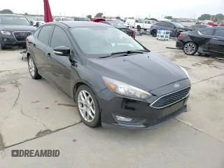 2015 Ford Focus SE z VIN 1FADP3F29FL357021, wystawiony jako Copart lot #57985125 z przebiegiem 142 786 mil mil oraz Szkoda całkowita • Salvage title. Historia ofert i sprzedaży dostępna na DreamBid. Obrazek 14.
