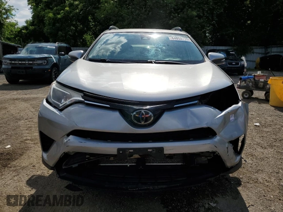 2018 Toyota RAV4 LE with VIN 2T3BFREV8JW788362, listed as a Copart auction lot 64053735 with 124,668 mi miles and Salvage title. Bid and sale history available at DreamBid. Image 5.