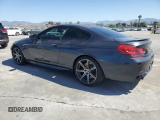 2015 BMW M6 z VIN WBSLX9C58FD160609, wystawiony jako Copart lot #56992535 z przebiegiem 52 324 mil mil oraz Tytuł czysty. Historia ofert i sprzedaży dostępna na DreamBid. Obrazek 2.