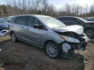 2015 Mazda 5 Touring with VIN JM1CW2CL4F0185773, listed as a Copart auction lot 48615505 with 105,488 mi miles and Salvage Title. Bid and sale history available at carsss.com. Image 4.