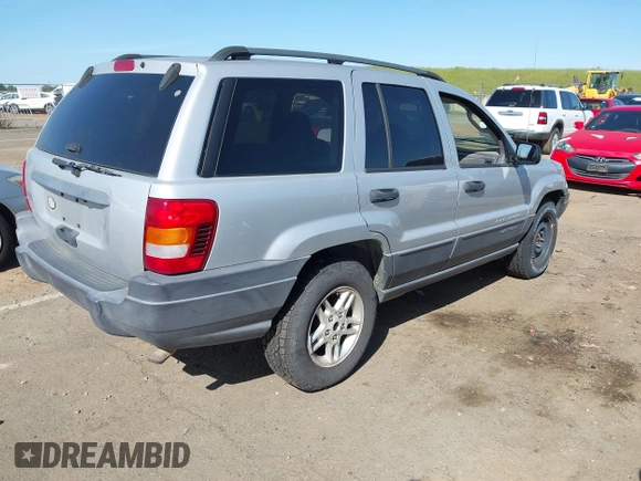 2003 Jeep Grand Cherokee Laredo with VIN 1J4GX48S03C577759, listed as a IAAI auction lot 41969103 with 91,305 mi miles. Bid and sale history available at carsss.com. Image 4.