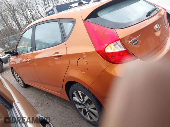2015 Hyundai Accent Sport with VIN KMHCU5AE3FU205849, listed as a IAAI auction lot 41827093 with 112,980 mi miles. Bid and sale history available at carsss.com. Image 3.