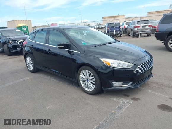 2017 Ford Focus Titanium z VIN 1FADP3N24HL326330, wystawiony jako IAAI lot #42594927 z przebiegiem 54 727 mil mil oraz . Historia ofert i sprzedaży dostępna na DreamBid. Obrazek 1.