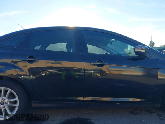 2015 Ford Focus SE with VIN 1FADP3F29FL350473, listed as a IAAI auction lot 41032182 with 102,898 mi miles. Bid and sale history available at carsss.com. Image 13.