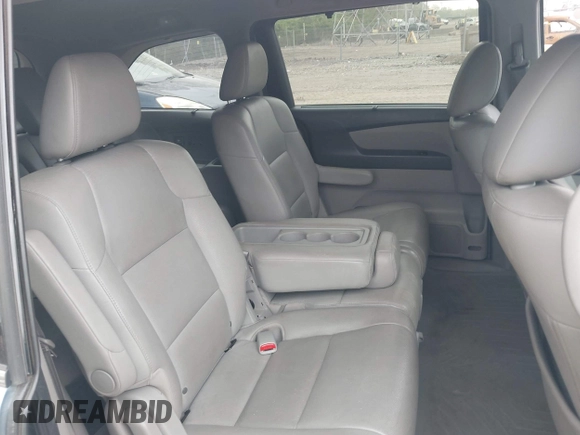 2014 Honda Odyssey Touring with VIN 5FNRL5H91EB081811, listed as a IAAI auction lot 42153920 with 16 mi miles and . Bid and sale history available at DreamBid. Image 8.