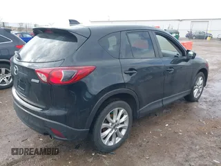 2014 Mazda CX-5 Grand Touring with VIN JM3KE4DY5E0373731, listed as a IAAI auction lot 41517852 with 148,414 mi miles. Bid and sale history available at carsss.com. Image 4.