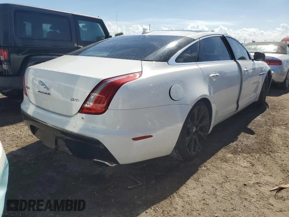 2014 Jaguar XJ Portfolio z VIN SAJWA2GZ0E8V59422, wystawiony jako Copart lot #74213414 z przebiegiem 96 314 mil mil oraz Nie do naprawy • Non repairable. Historia ofert i sprzedaży dostępna na DreamBid. Obrazek 3.