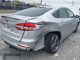 2019 Ford Fusion Titanium with VIN 3FA6P0K96KR120749, listed as a IAAI auction lot 40737085 with 118,376 mi miles and . Bid and sale history available at DreamBid. Image 6.