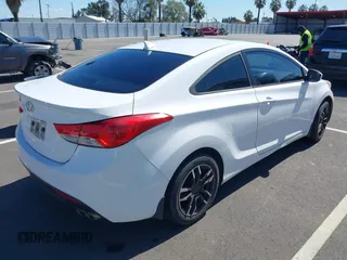 2013 Hyundai Elantra Coupe SE with VIN KMHDH6AE9DU022676, listed as a IAAI auction lot 41816486 with 158,326 mi miles. Bid and sale history available at carsss.com. Image 4.